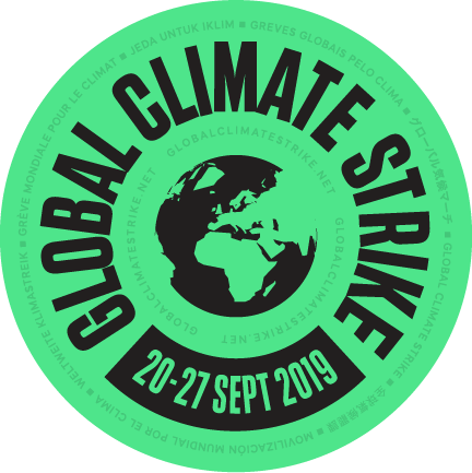A circular badge design with 'Global Climate Strike' in a ring around the edge and an image of the Earth in the center