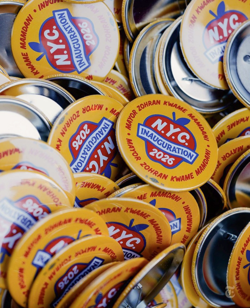 Close-up of a pile of that read 'N.Y.C Inauguration 2026'.